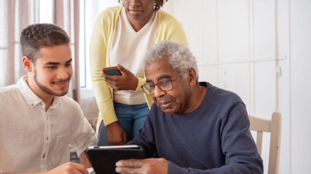 a group of people using modern gadgets