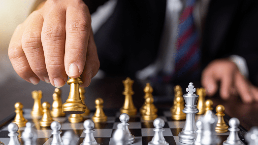 a man using a strategy in a chess match