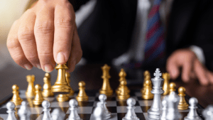 a man using a strategy in a chess match