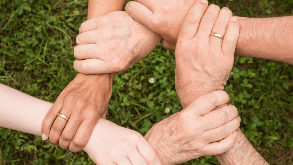 group of people holding each other